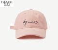 Rosa CAPS med tekst "dog mama"